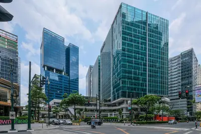 a city with tall glass buildings in a city at Uptown Parksuites Modern Room in Manila