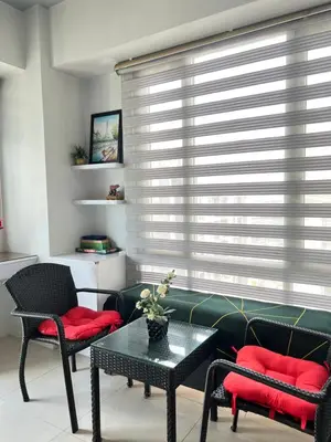 a living room with a couch and two chairs and a table at Condotel Across Naia Airport with WIFI in Manila