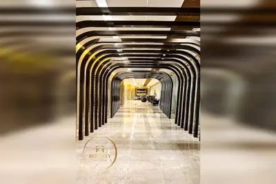 a long hallway in a building with a tunnel at MOA Shore 3 New Modern One bedroom Condo in Manila