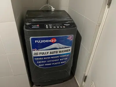 a trash can in the corner of a bathroom at Fabulous Skyline KL Greenbelt Makati in Manila