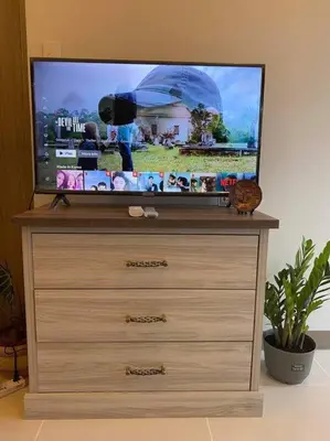 a flat screen tv sitting on top of a dresser at SMDC Coast Residences Condo near MOA, CCP, PICC, Star City in Manila