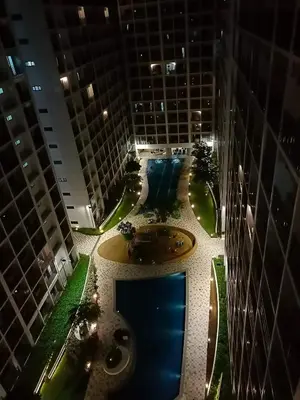 an aerial view of a building with a fountain in the middle at MiamiViceLuxuryStays at Shore2 in Manila