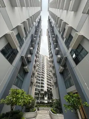 a tall building with balconies on the side of it at Cozy Studio Viceroy Residences McKinley Hill Bgc in Manila