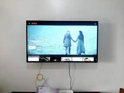 a flat screen tv hanging on a wall at Air Residence Makati in Manila
