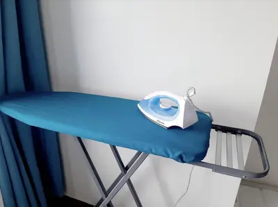 a phone sitting on a table in a hospital room at Air Residence Makati in Manila
