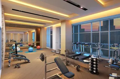 a rendering of a gym with treadmills and weights at StayHere Skandanavian Designed 1BR in Greenbelt in Manila