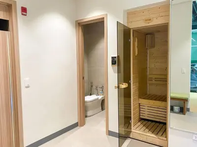 a bathroom with a walk in shower and a toilet at Modern and homely Condo in Shaw Boulevard in Manila