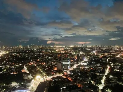 a view of a city at night with lights at Modern and homely Condo in Shaw Boulevard in Manila