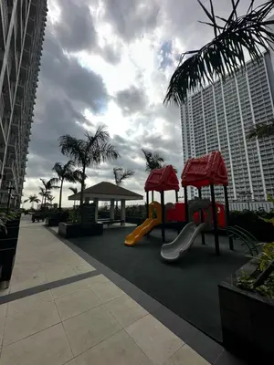a playground with a slide and a slideintend at Chen's Cozy 2bedroom @ Coast Residences in Manila