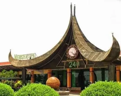 a building with a clock on the front of it at Chen's Cozy 2bedroom @ Coast Residences in Manila