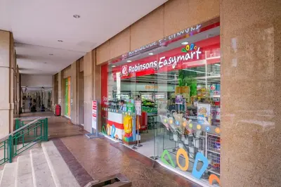 a store front of a store with a lot of products at StayHere The Florence Luxe 1BR Near Venice Mall in Manila