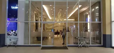 a large glass window in a shopping mall at Jazz Residences Makati in Manila
