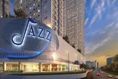 a large building with a large apple sign on it at Jazz Residences Makati in Manila