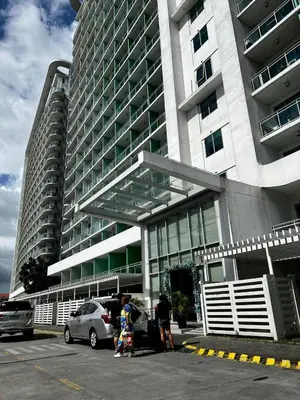 a large building with people standing in front of it at Azure Urban Resort Staycation by LV in Manila