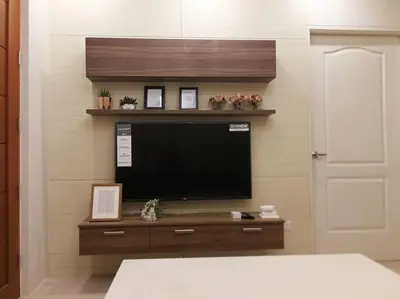 a bedroom with a television on a wall at Adria Residences - Emerald Garden - 2 Bedroom Unit for 4 person in Manila