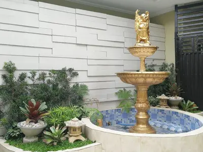 a fountain in the middle of a garden at Adria Residences - Emerald Garden - 2 Bedroom Unit for 4 person in Manila