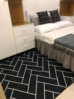 a bedroom with two beds and a dresser at Cozy 2BR corner unit in a prime location, your perfect city home in Manila