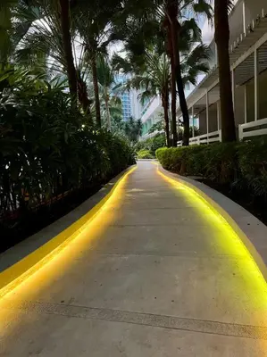 a road with yellow lights on the side of a building at Scr AzureINetflixIBalconyIGames in Manila