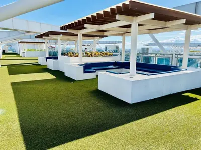a pavilion on top of a building with green grass at Scr GlamourINetFlixIBalconyICozy in Manila