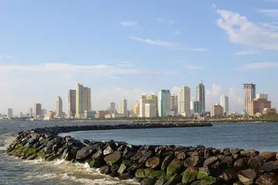 a view of a city from the water at Loveness Apartelle in Manila