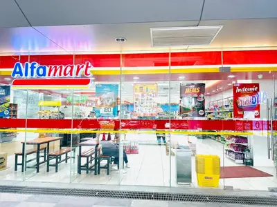 a store front of a store with tables and chairs at Coast Residences - 2 Bedroom with Balcony facing Mall of Asia, Manila Bay & Pool View in Manila