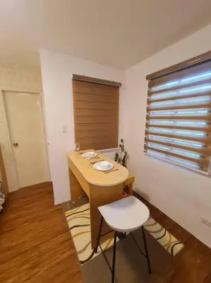 a room with a desk and a chair and a window at Muji-Inspired, Studio-Type Home at Phirst Park Homes Tanza in Tanza