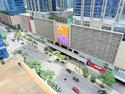 an aerial view of a city with cars on a street at Uptown Parksuites BGC in Manila