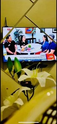 a television screen with a picture of a group of people at Field Residence SMDC 1BR w/ Netflix in Manila