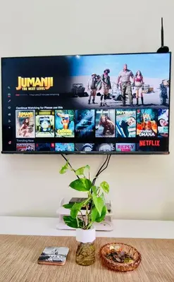 a flat screen tv hanging on a wall at Field Residence SMDC 1BR w/ Netflix in Manila