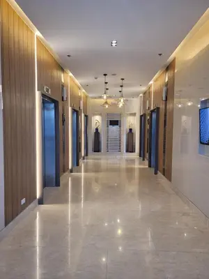 a hallway of a building with wooden walls and a long hall at A&R Condo by the Bay in Manila