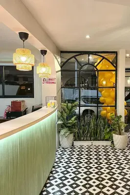 a restaurant with a counter and a window with a car at Aurora Suites Pasay near Airport in Manila
