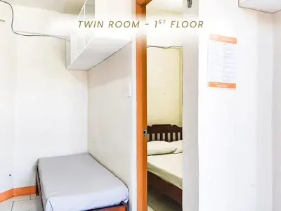 a small room with a bunk bed and a small bedroom at Cenco Suites Residences - Transient in Tanza Cavite in Tanza