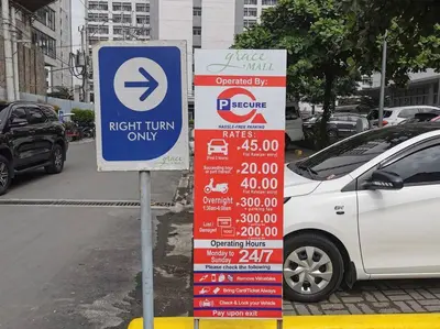 a sign for a right turn only sign next to a car at Love@Grace Residences near BGC. in Manila