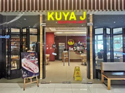 a kiya j restaurant with a sign in the window at Love@Grace Residences near BGC. in Manila