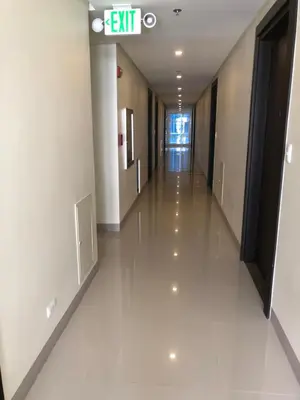an empty hallway in a building with a hallway at 101 Newport Boulevard-Favila Condotel Unit near Airport in Manila