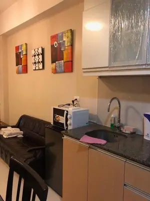 a kitchen with a sink and a counter top at 101 Newport Boulevard-Favila Condotel Unit near Airport in Manila
