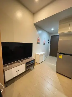 a living room with a large flat screen tv at EJ's Staycation 4th F with 200mbps Wi-Fi and NETFLIX in Manila
