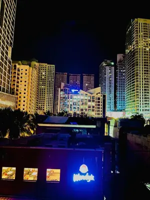a view of a city skyline at night at EJ's Staycation 4th F with 200mbps Wi-Fi and NETFLIX in Manila