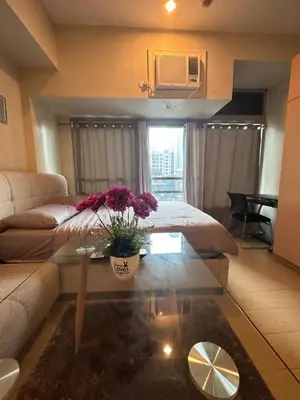 a living room with a couch and a coffee table at EJ's Staycation 4th F with 200mbps Wi-Fi and NETFLIX in Manila