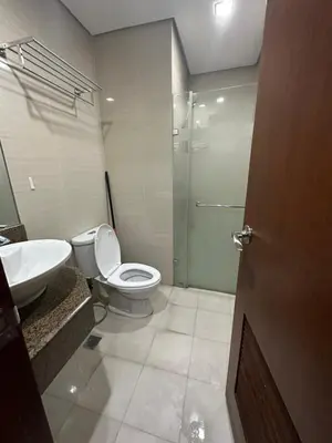 a bathroom with a toilet and a sink and a shower at EJ's Staycation 4th F with 200mbps Wi-Fi and NETFLIX in Manila