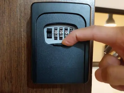 a hand is pressing a button on a cabinet at KENN PROPERTY in Manila