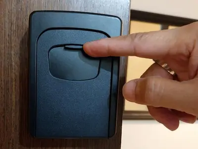 a person holding a door handle with their finger at KENN PROPERTY in Manila