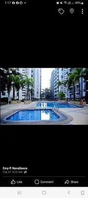 a television screen with a picture of a swimming pool at KENN PROPERTY in Manila