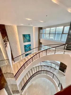 a spiral staircase in a building with a view at Coast Residence 4026 PENTHOUSE 1 Bedroom Condo with Wifi & Netflix in Manila