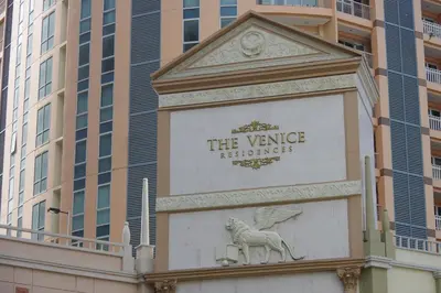 a sign on the side of a building at Luxe in Venice in Manila