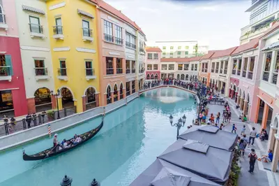 a gondola on a canal in a shopping mall at Luxe in Venice in Manila