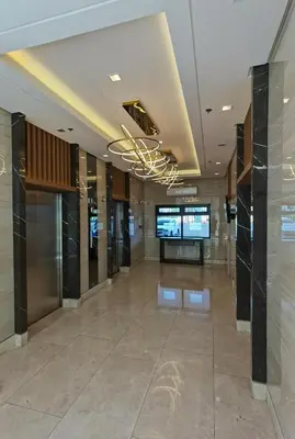 a lobby of a building with a large tile floor at Condominium at Spring Residences near Airport in Manila