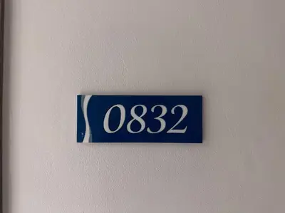 a blue and white sign on a wall at Hygge Suite @ Moa complex near Naia, Ccp , Dfa in Manila