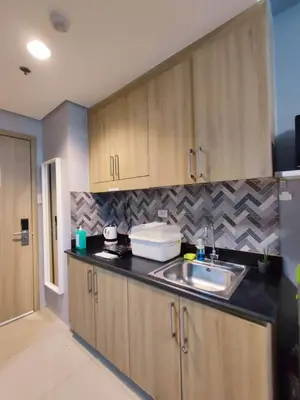 a kitchen with a sink and a counter top at Homestay Manila Mall of Asia Shore Residences at TresMarias' in Manila