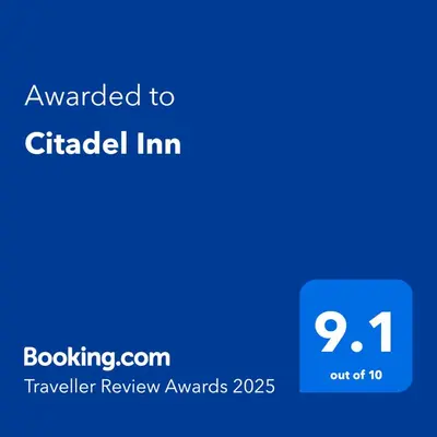 a blue text box with the words awarded to circled im at Citadel Inn in Manila
